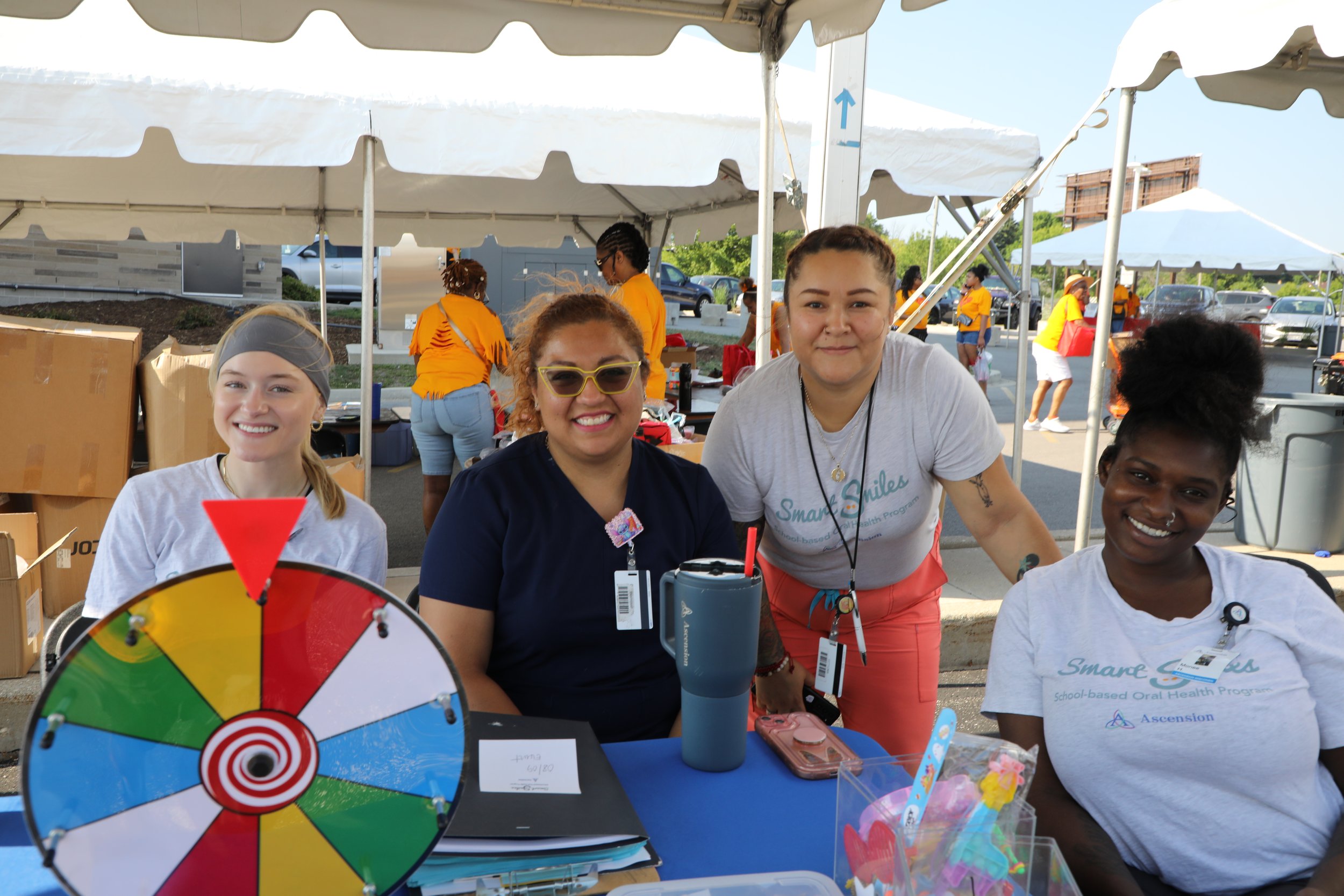 Outreach volunteers at a community health table